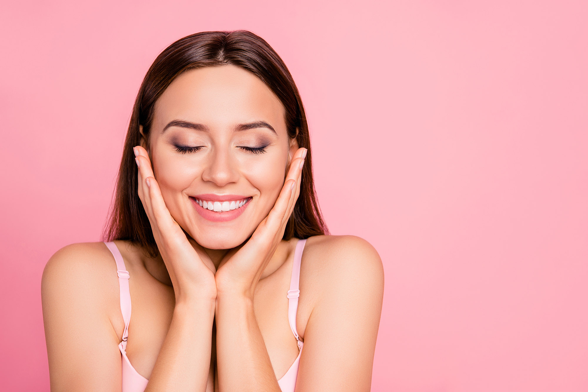 Woman using moisturizer on skin
